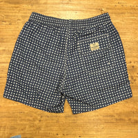 White polka dots on blue swim short