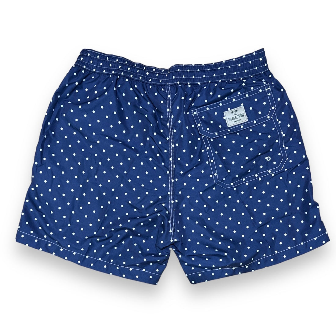 White dots on solid navy blue swimsuit