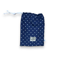 White dots on solid navy blue swimsuit