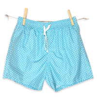 White dots on solid cyan swimsuit