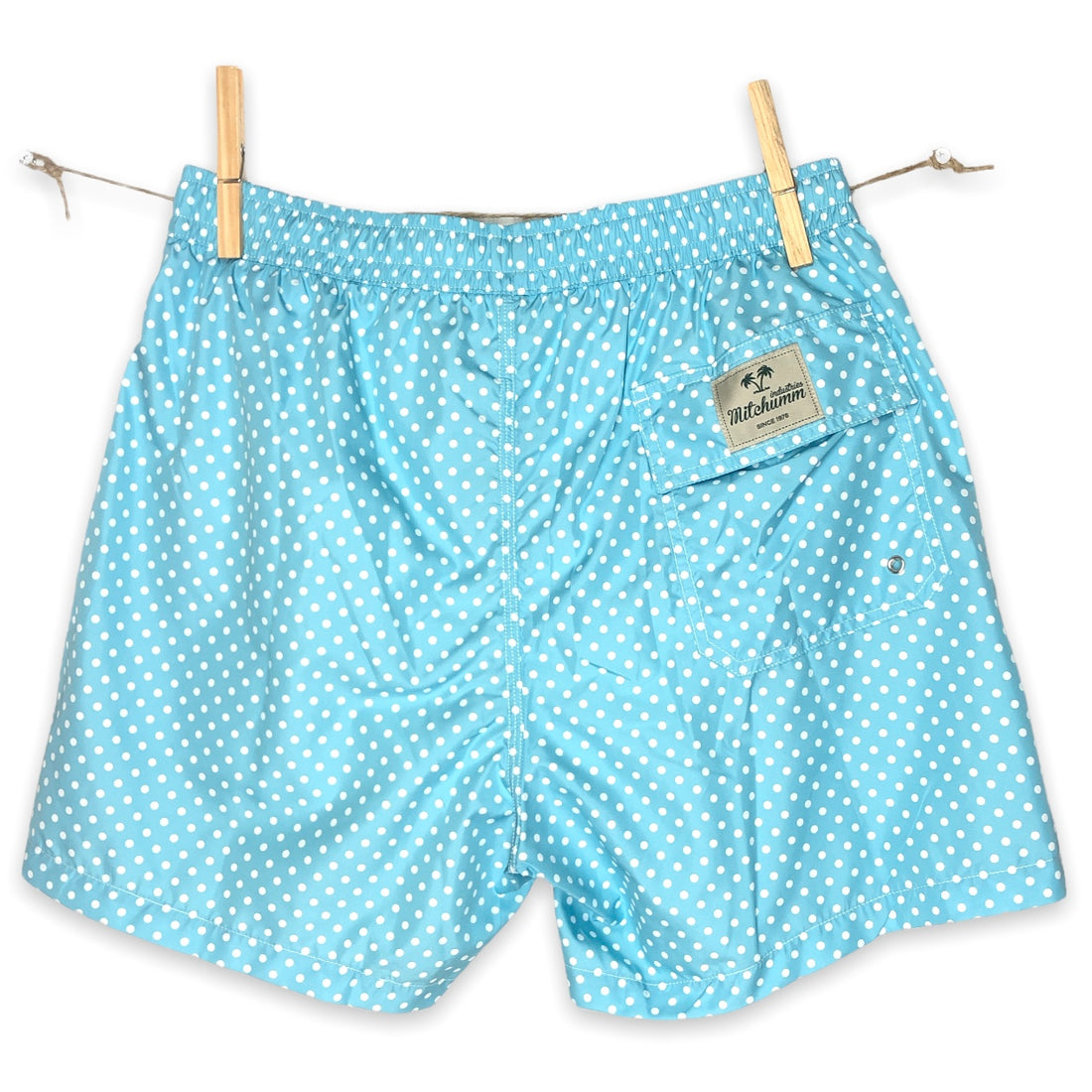 White dots on solid cyan swimsuit