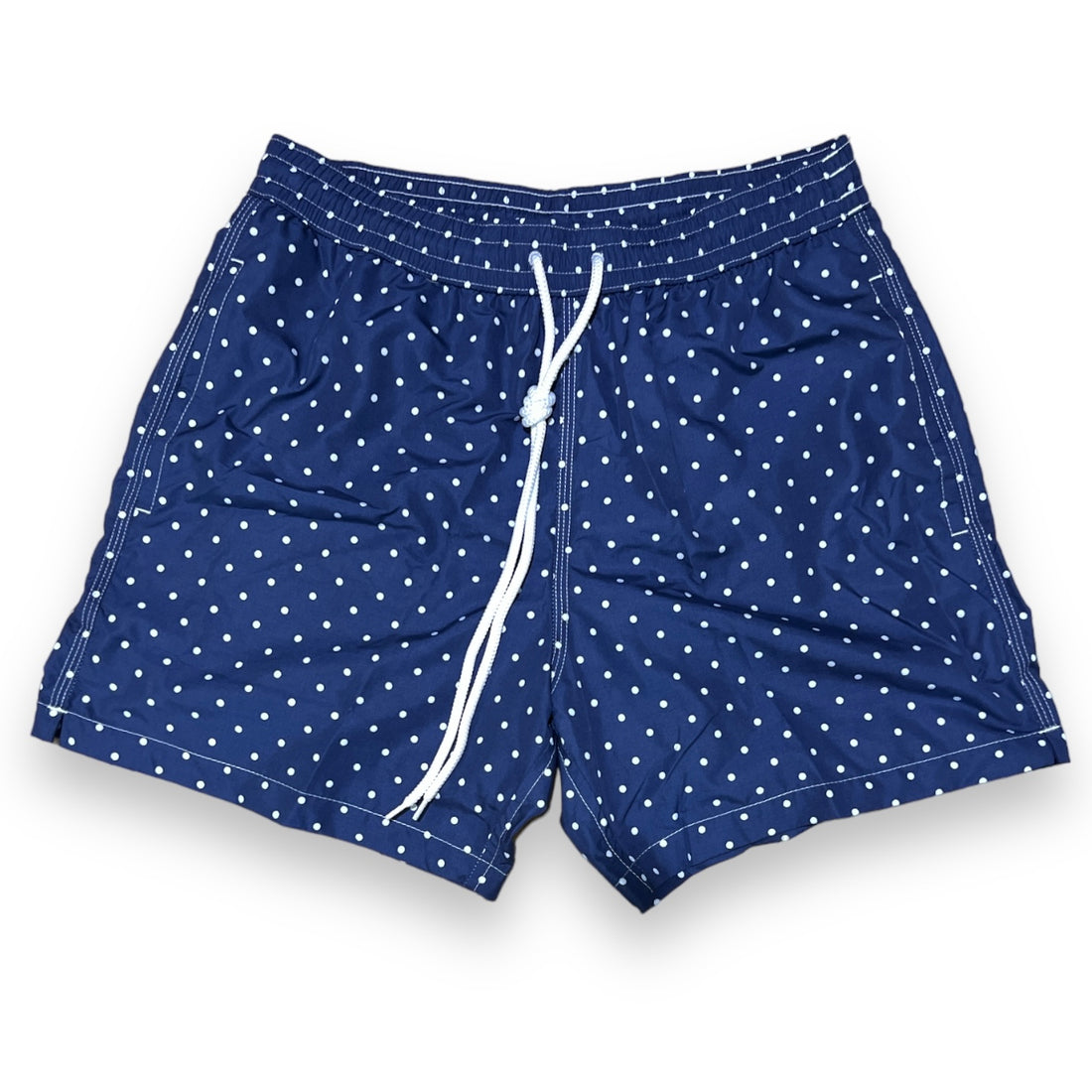 White dots on solid navy blue swimsuit
