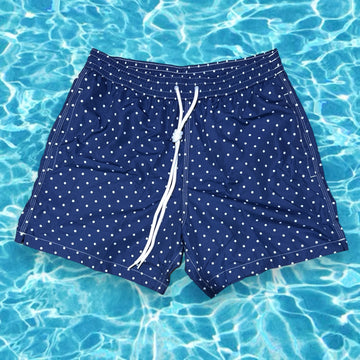 White dots on solid navy blue swimsuit